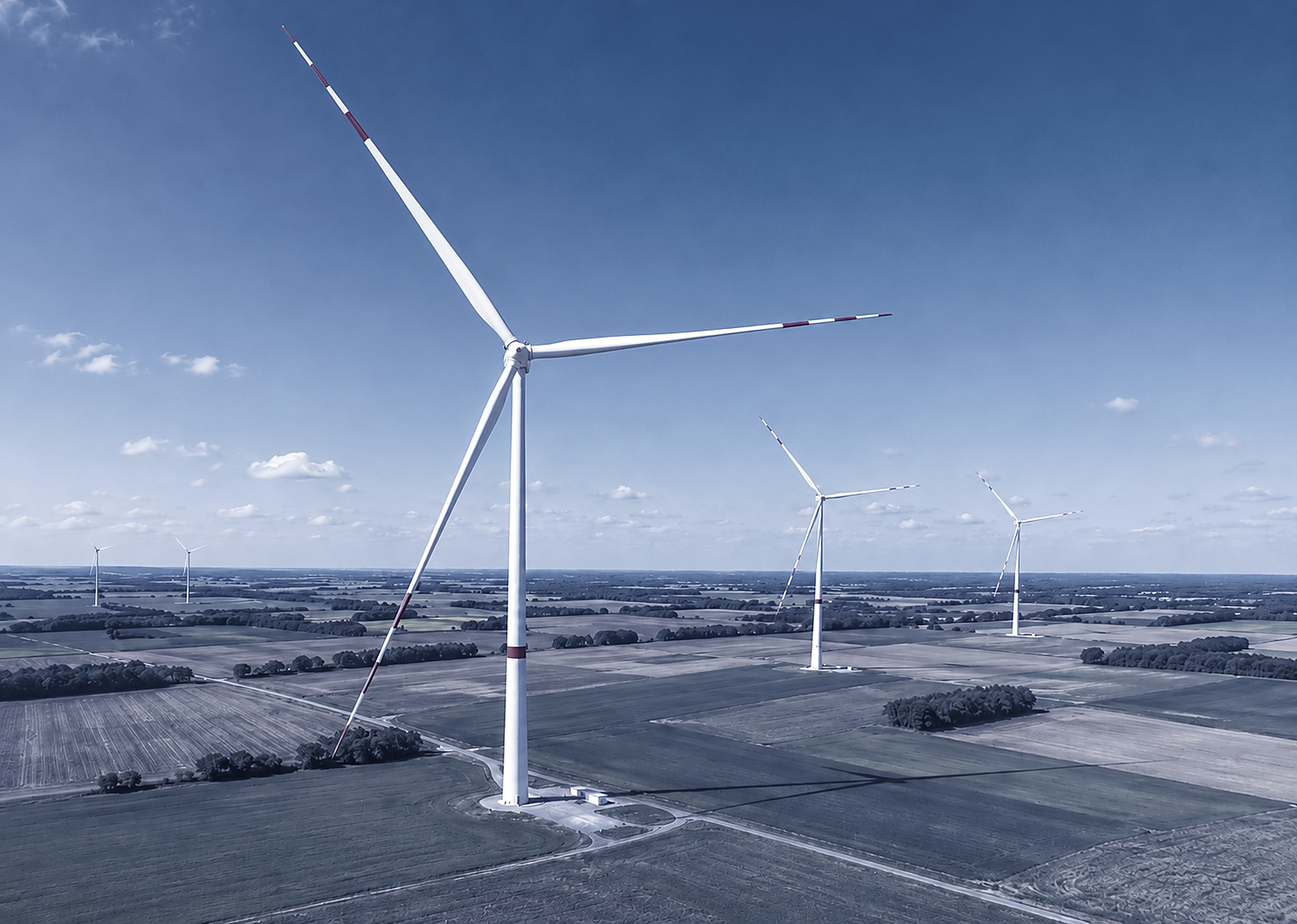 A wind farm spread across open farmland